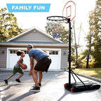 Father and son playing on the driveway hoop