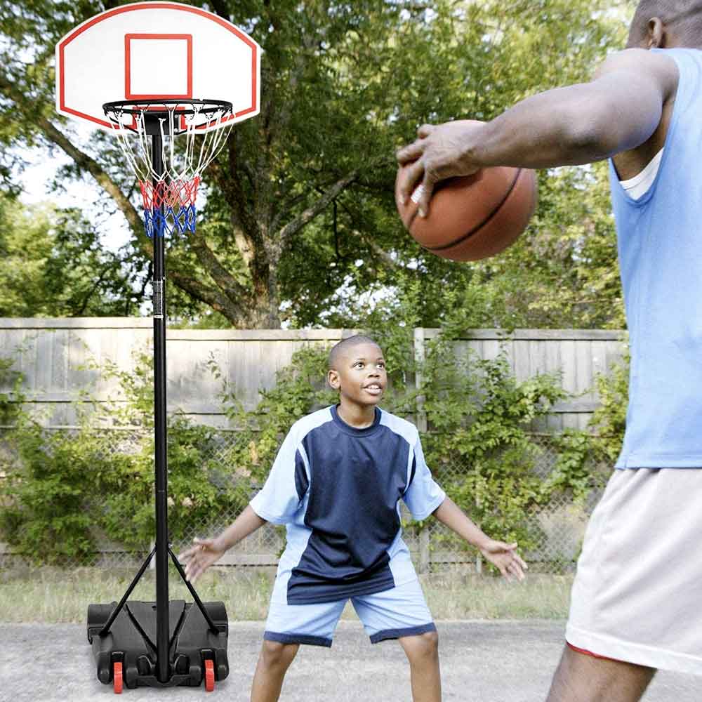 Kids playing one-on-one at the portable hoop