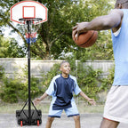 Kids playing one-on-one at the portable hoop