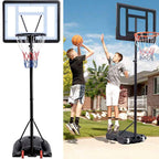 Two boys playing on the youth hoop in a front yard
