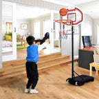 Boy shooting at the kids hoop indoors
