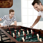 Father and son laughing over a foosball game