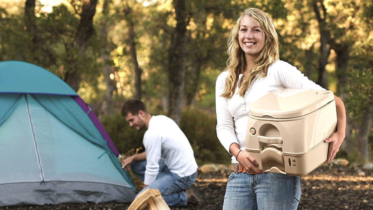 Portable flush toilet set up at an RV campsite