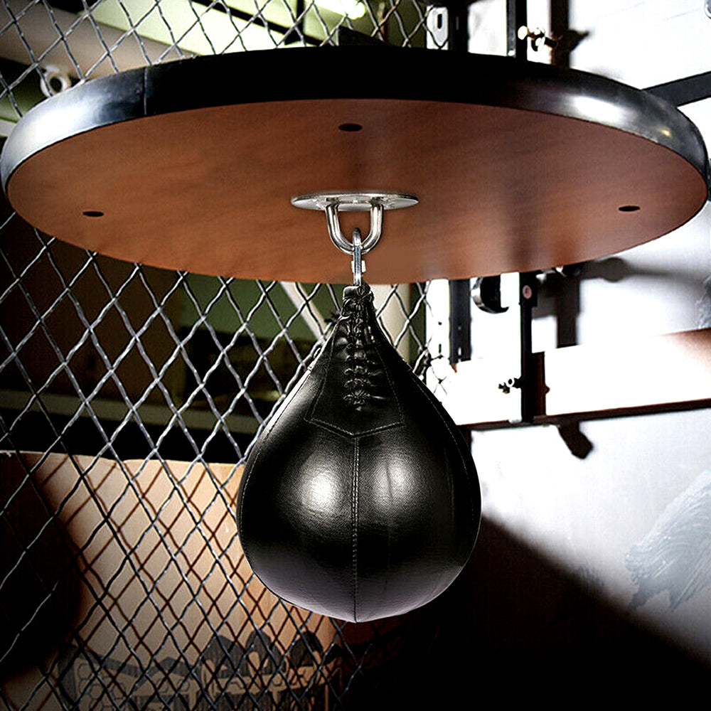 Black speed bag hanging from the round platform