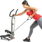 Woman doing a band row exercise beside the stepper