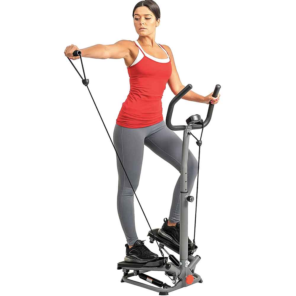 Woman using the silver stair stepper with resistance bands