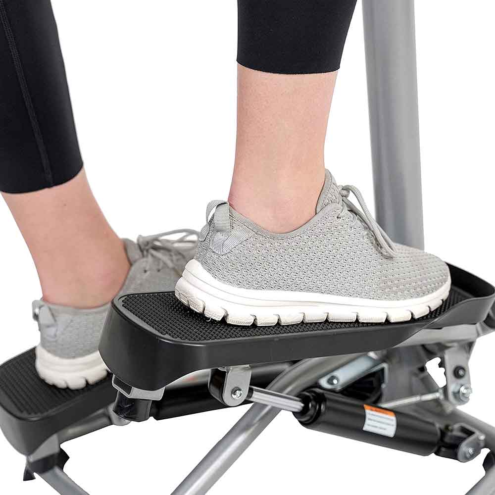 Close-up of a foot on the non-slip stepper pedal