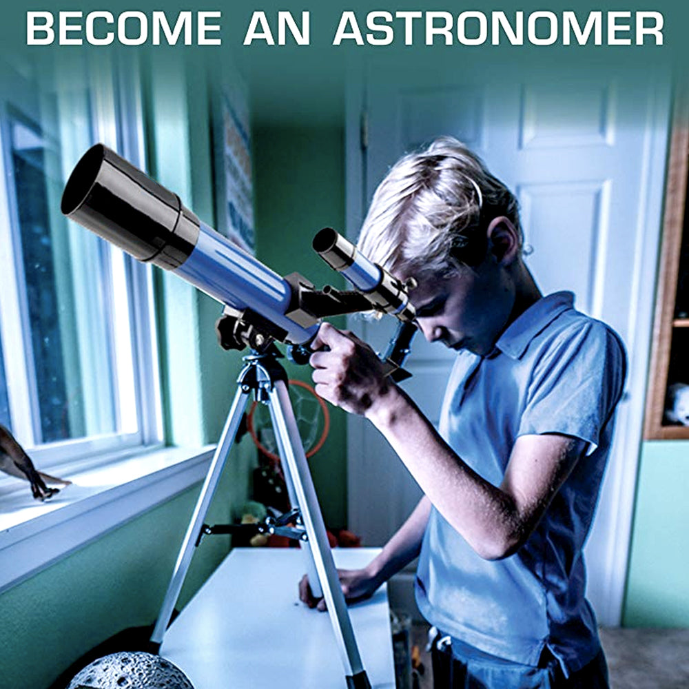 Boy looking through the telescope by a window