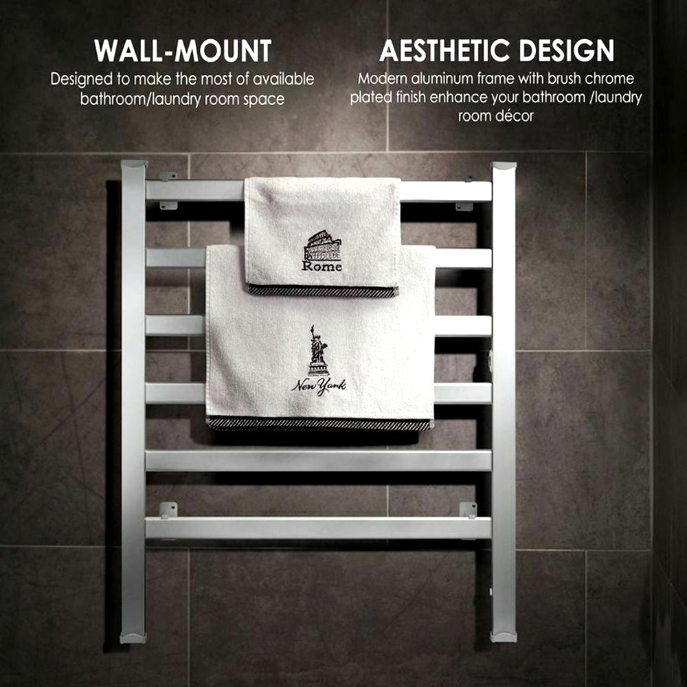 Towel warmer mounted on a dark tiled wall