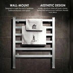 Towel warmer mounted on a dark tiled wall