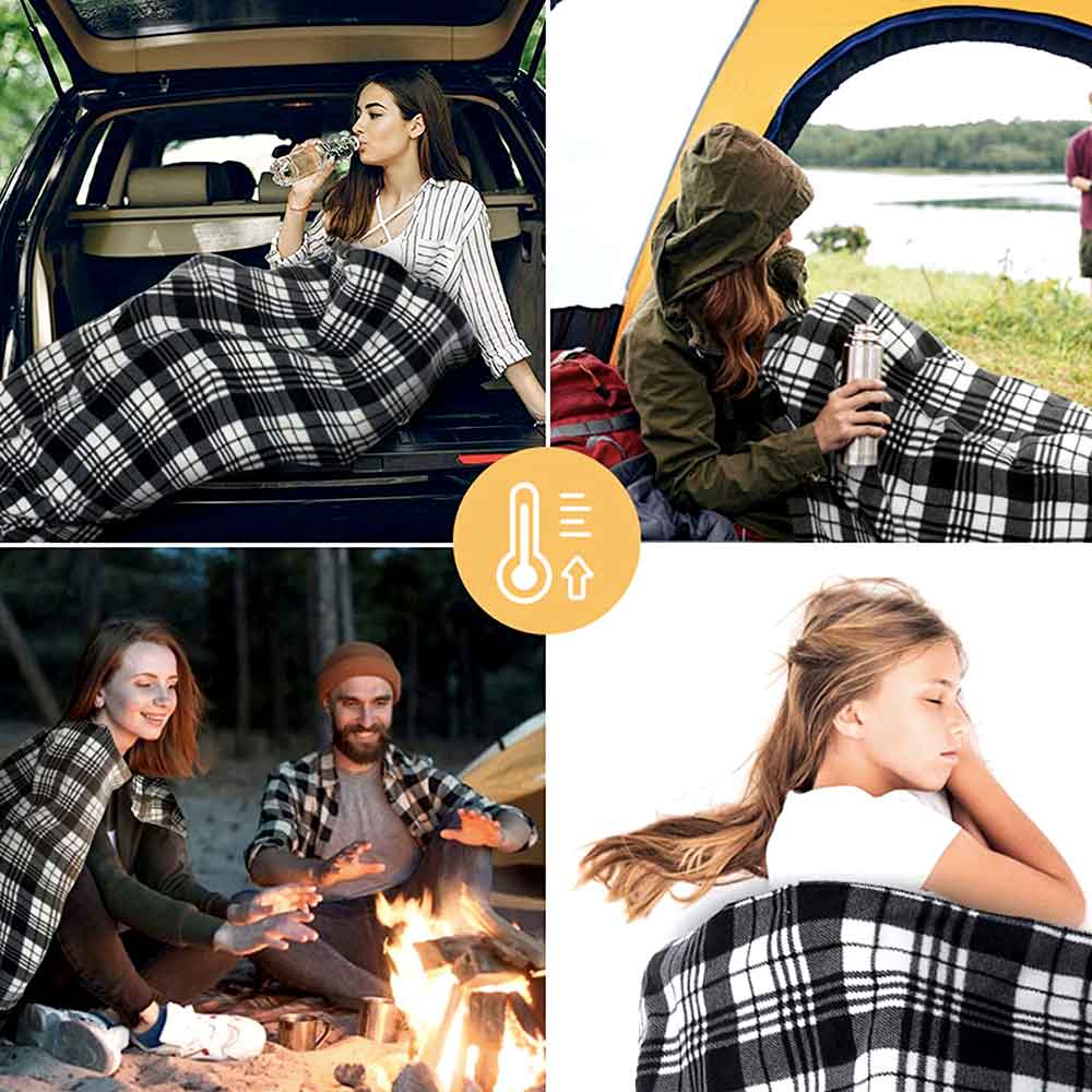 Passengers sharing a plaid heated blanket in a car