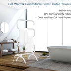 Heated towel warmer rack beside a bathtub in a bright bathroom