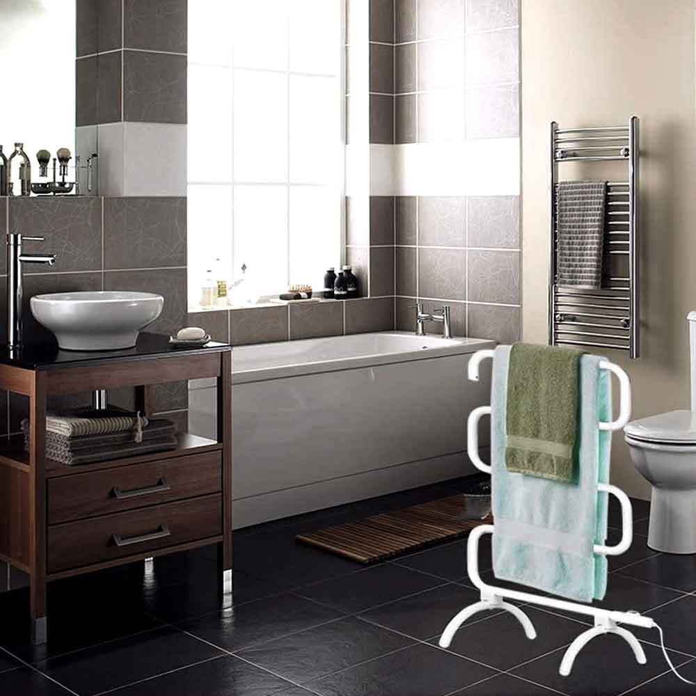 Freestanding towel warmer with towels in a tiled bathroom
