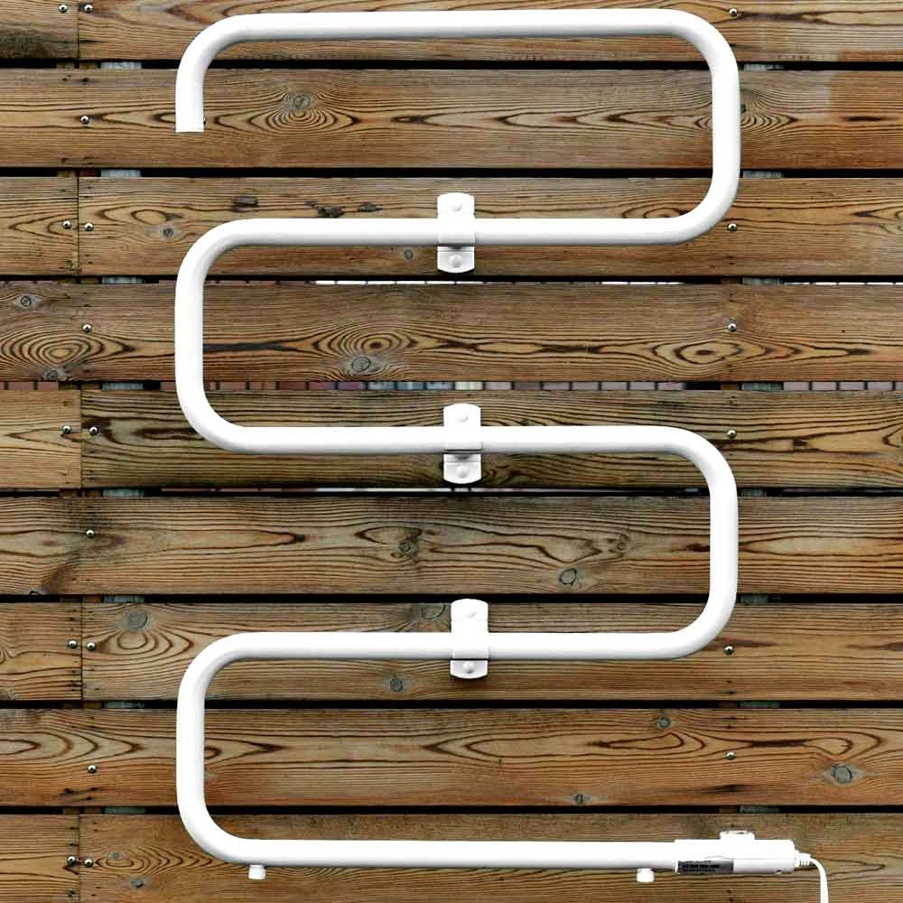 Heated towel warmer rack mounted on a wood wall
