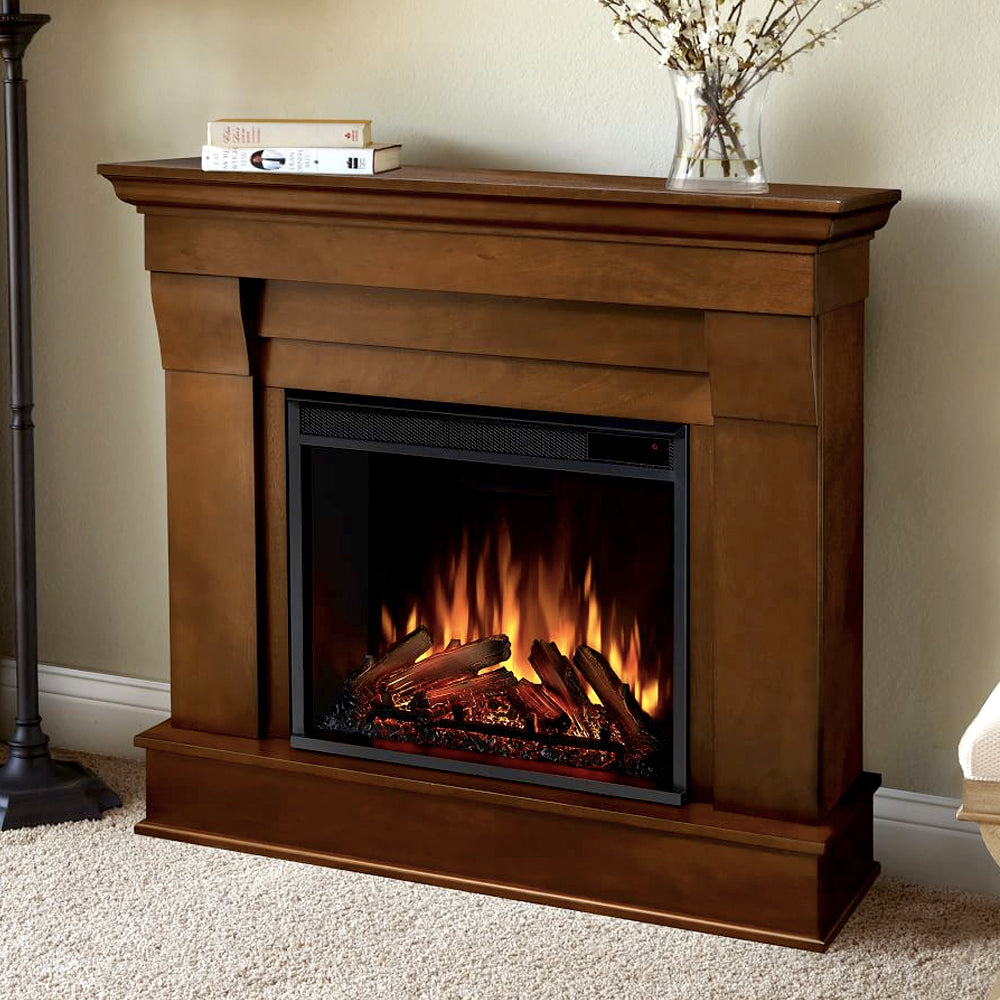Electric fireplace insert in a wood mantel surround